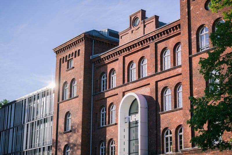 Main building of Technical University of Hamburg, featuring modern architecture and green spaces on the urban campus.